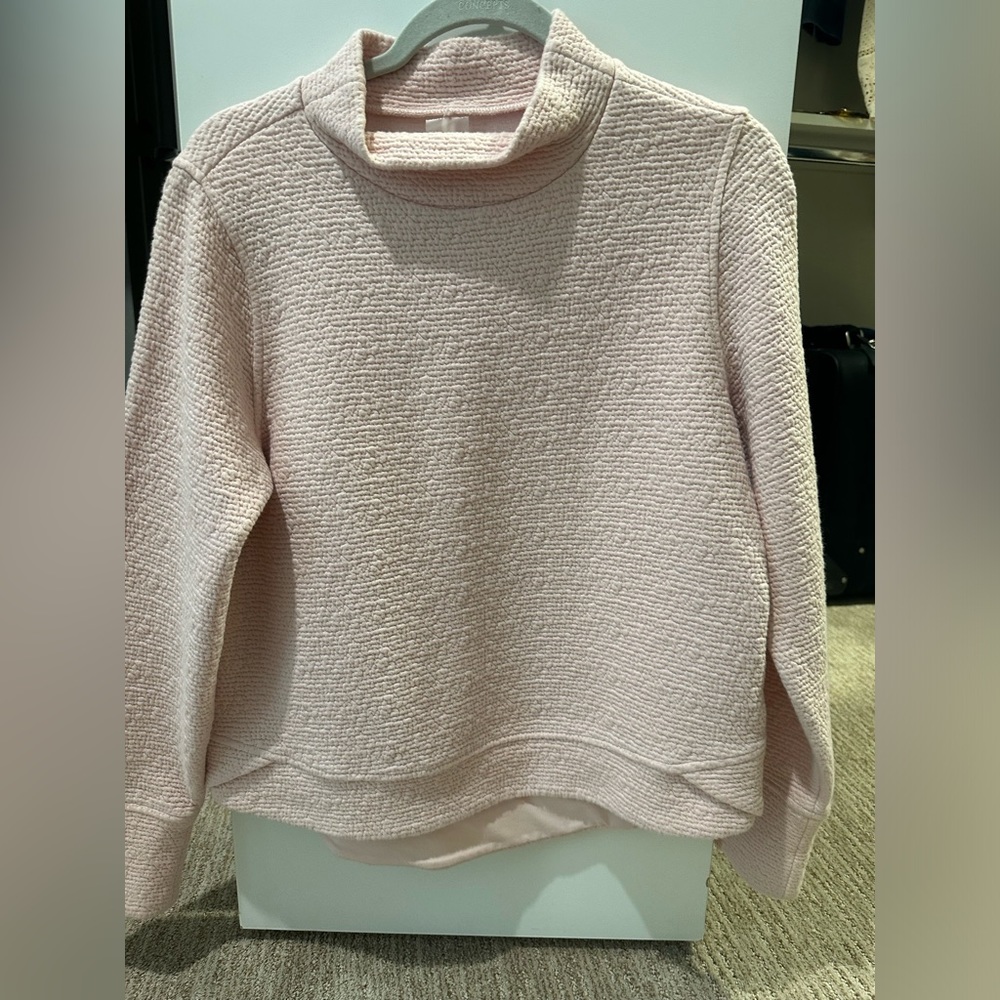 Light pink sweatshirt.